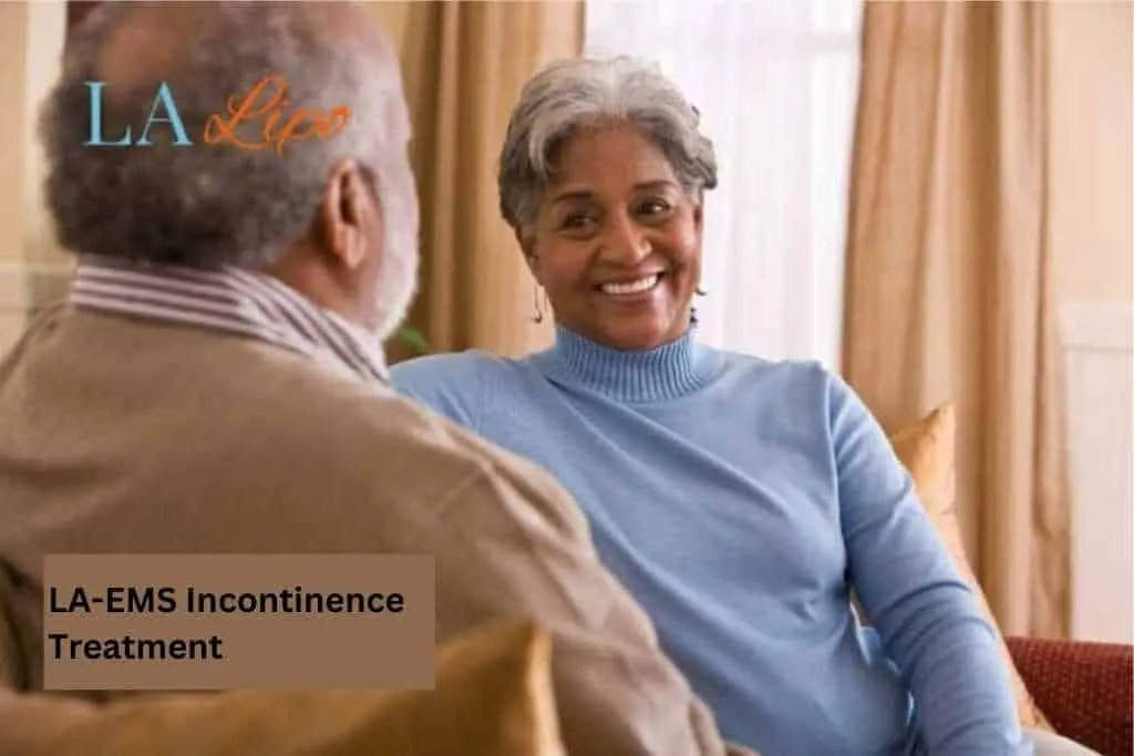 Couple sat smiling at each other - LA-EMS treatment Banbury
